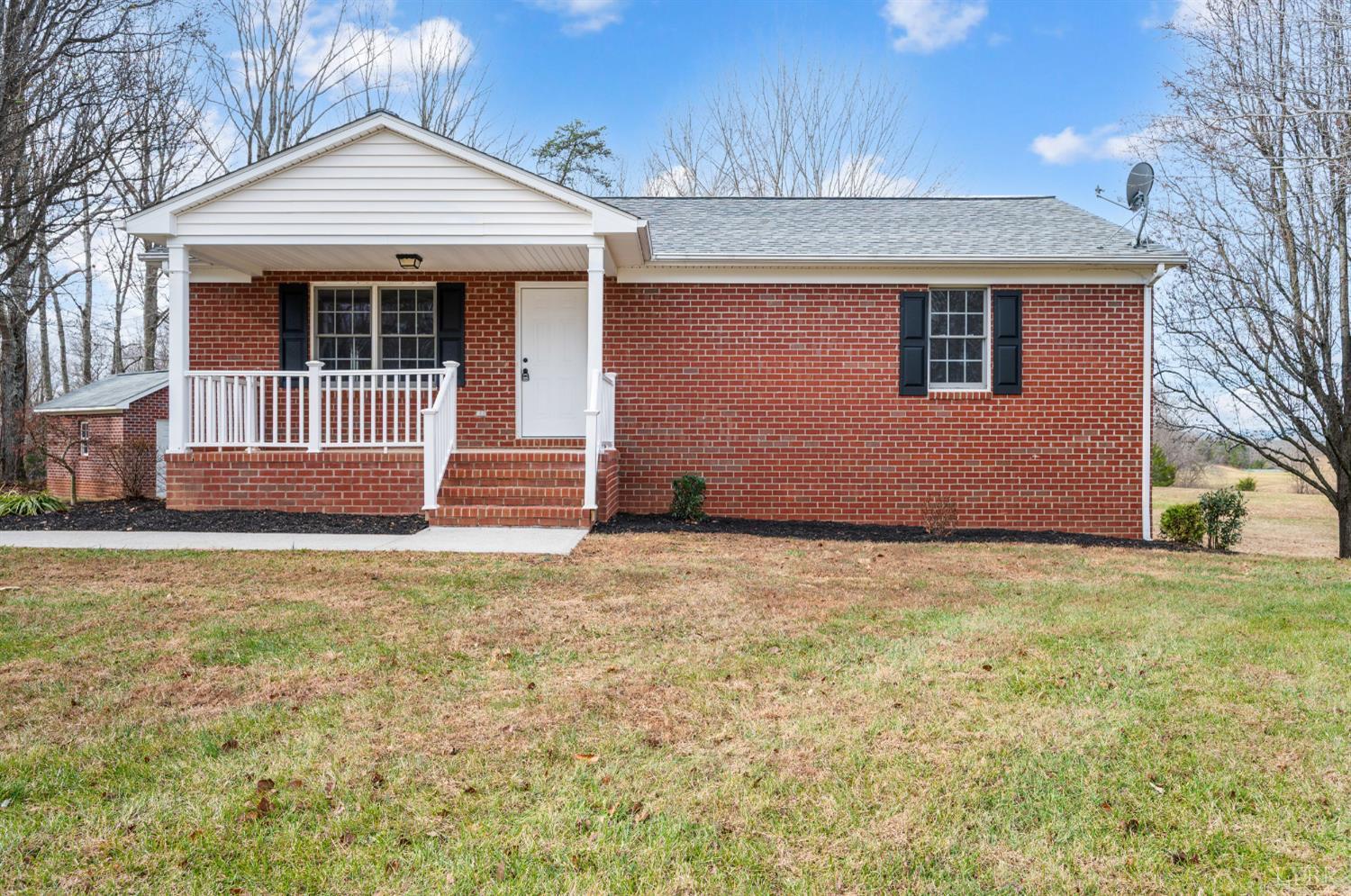 2365 Police Tower Road Appomattox, VA 24522 - Photo 2 of 52 a front view of a house with a garden