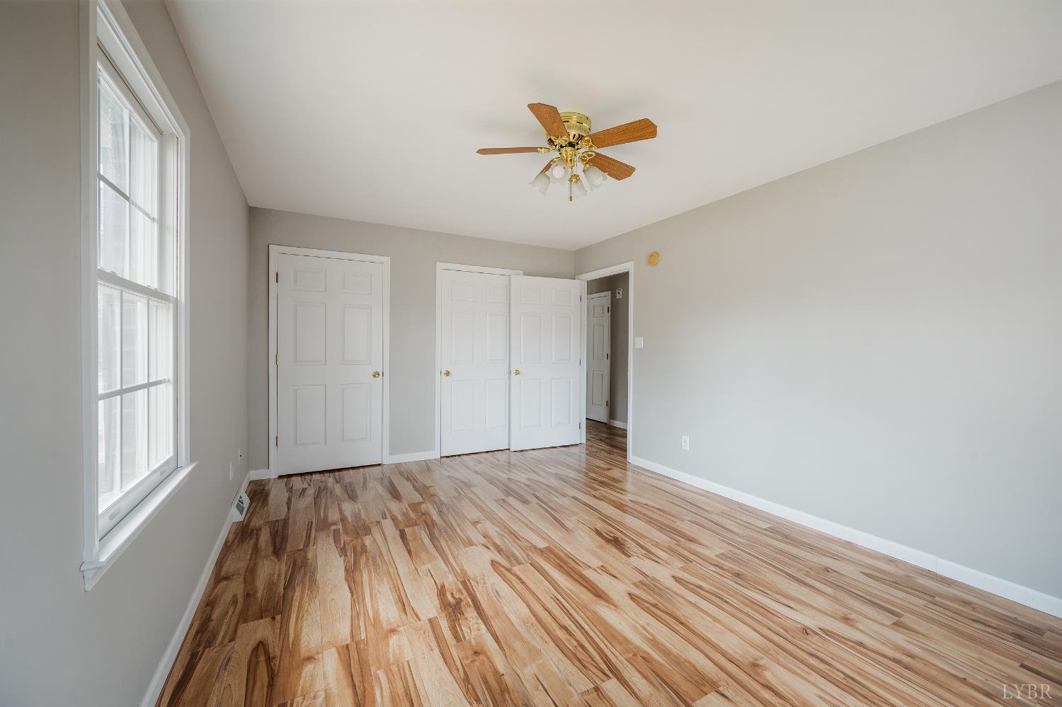 2365 Police Tower Road Appomattox, VA 24522 - Photo 25 of 52 a view of empty room with wooden floor and fan