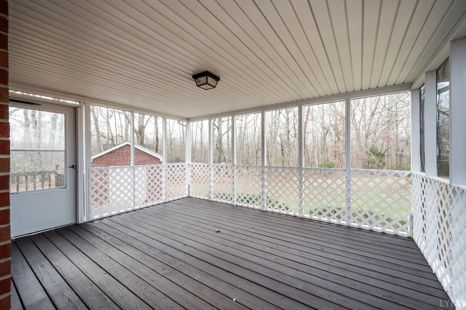 2365 Police Tower Road Appomattox, VA 24522 - Photo 30 of 52 a view of an empty room with wooden floor and a window