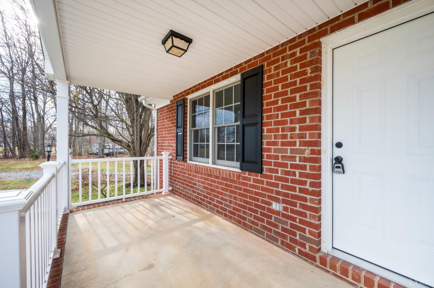 2365 Police Tower Road Appomattox, VA 24522 - Photo 5 of 52 a view of porch with wooden floor and fence