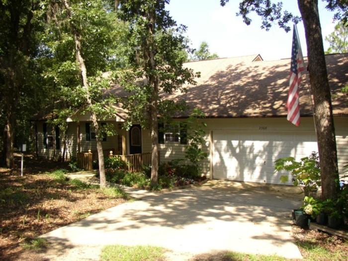2368 Spring Lake Road DeFuniak Springs, FL 32433 - Photo 1 of 1 a view of a yard with a tree