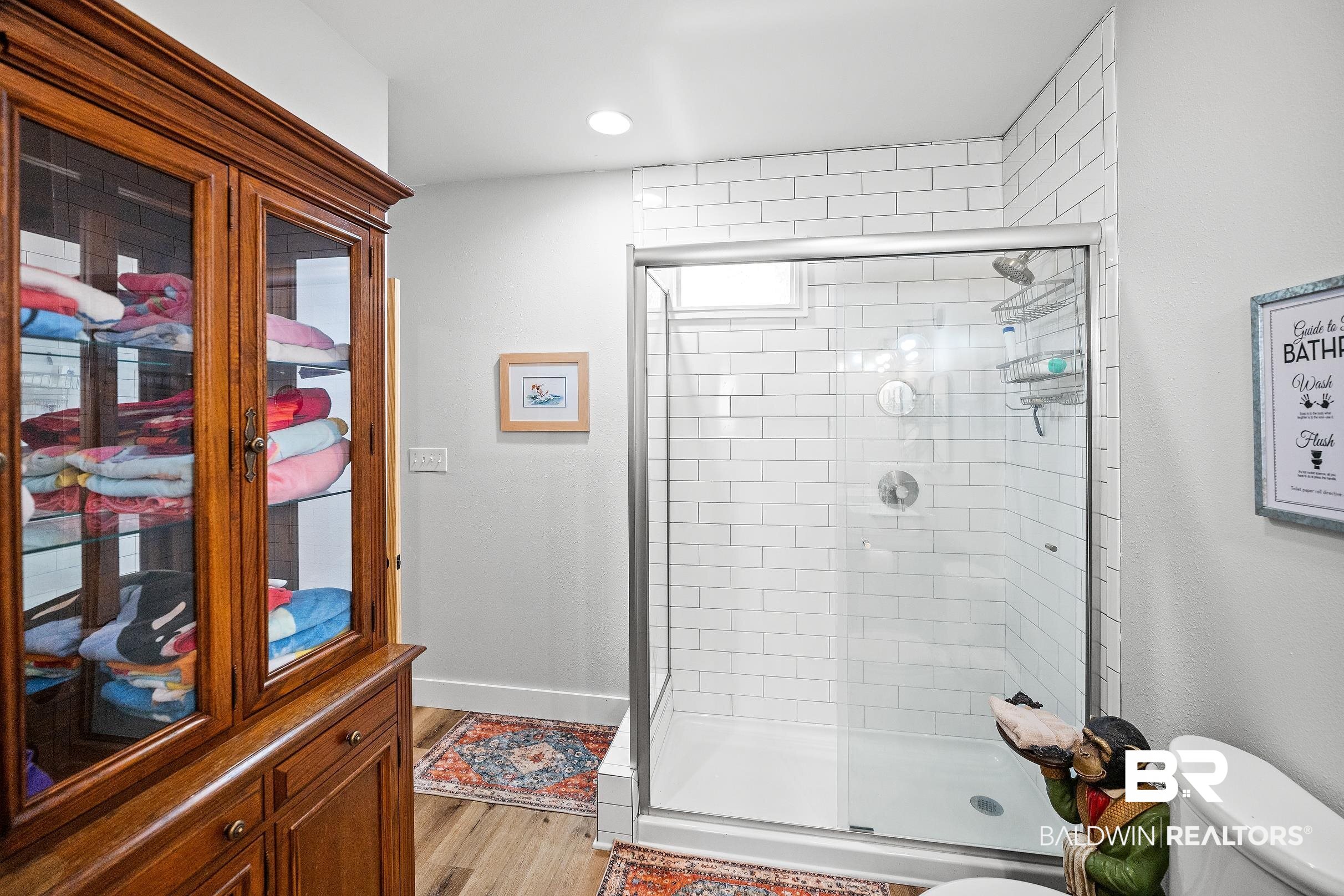 8490 Bay View Drive Foley, AL 36535 - Photo 54 of 67 Bathroom with a shower stall, light wood finished floors, and recessed lighting