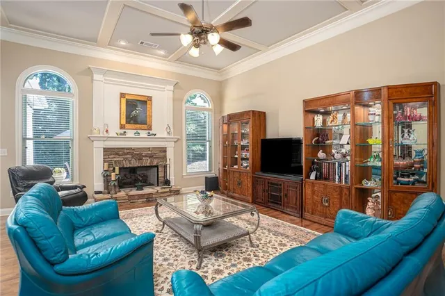 a living room with furniture fireplace and a flat screen tv