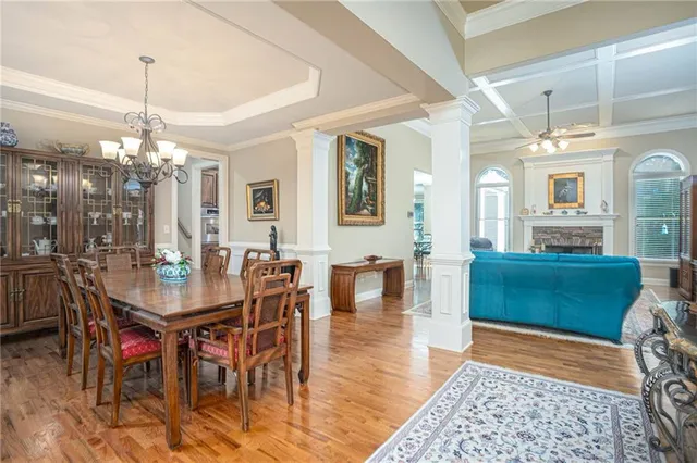 a dining room with furniture and window