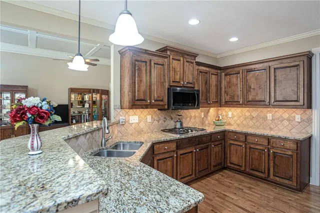 a kitchen with sink cabinets and window