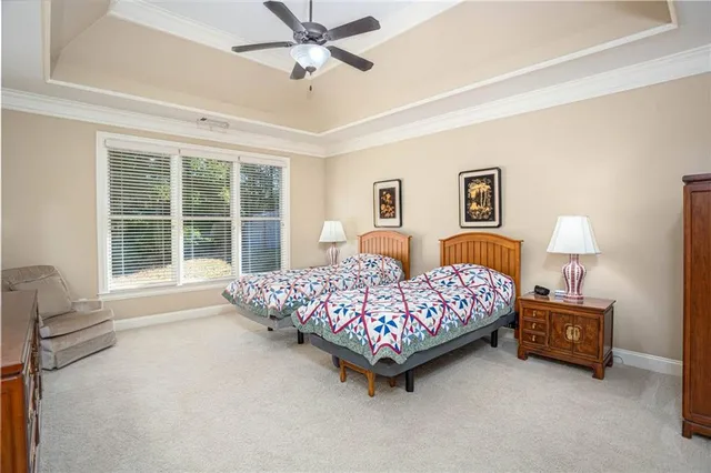 a bedroom with a bed couch and window