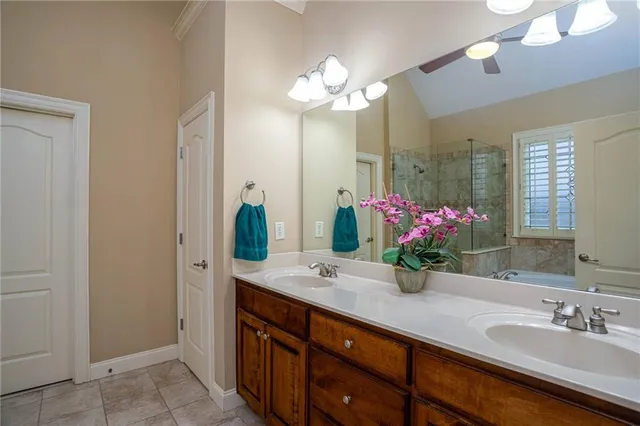 a bathroom with a double vanity sink and a mirror