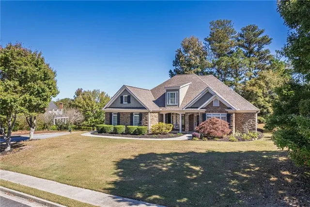 a front view of a house with a yard