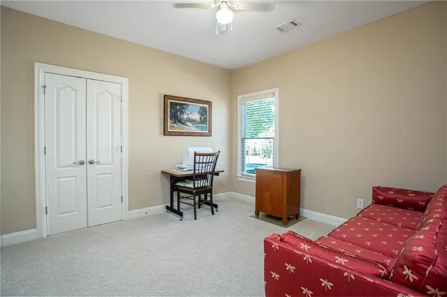 a bedroom with a bed and a dresser in it