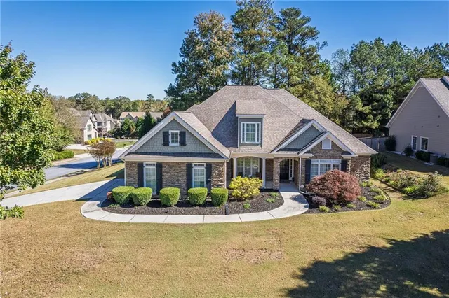 a front view of a house with a yard