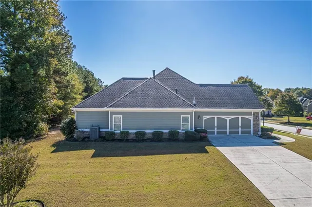 a front view of a house with a yard