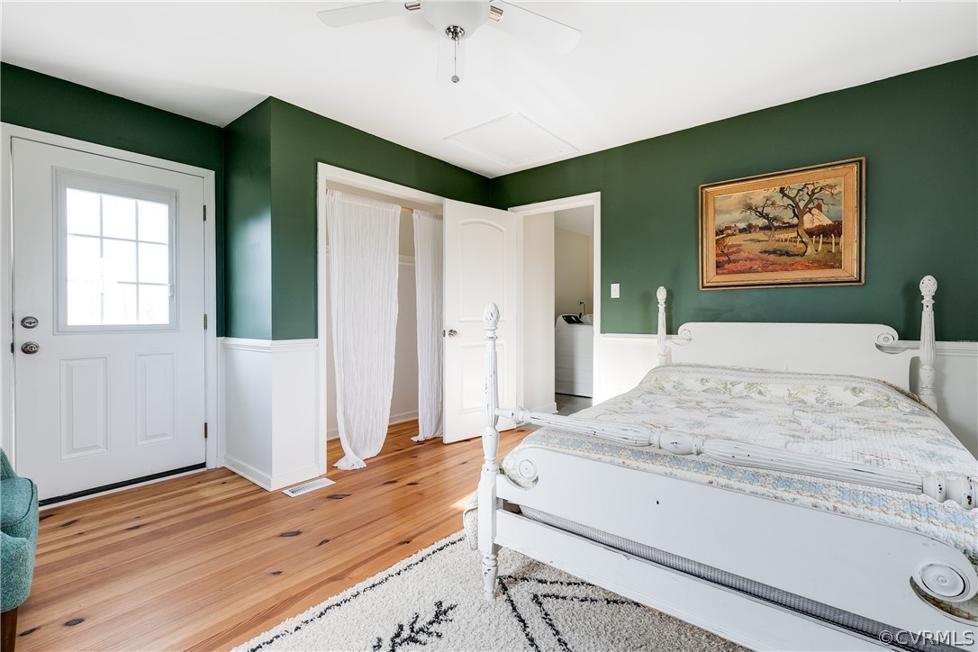4109 Whitehall Road Sandy Hook, VA 23153 - Photo 15 of 28 a bedroom with a bed and a dresser with wooden floor