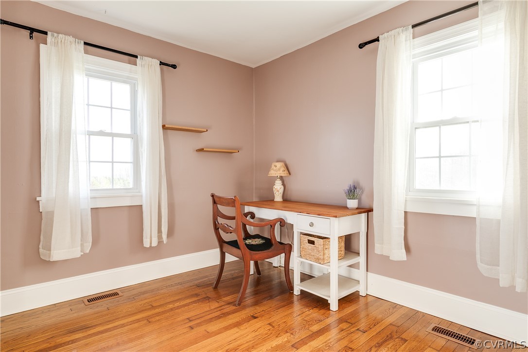 4109 Whitehall Road Sandy Hook, VA 23153 - Photo 17 of 28 a dining room with furniture and wooden floor