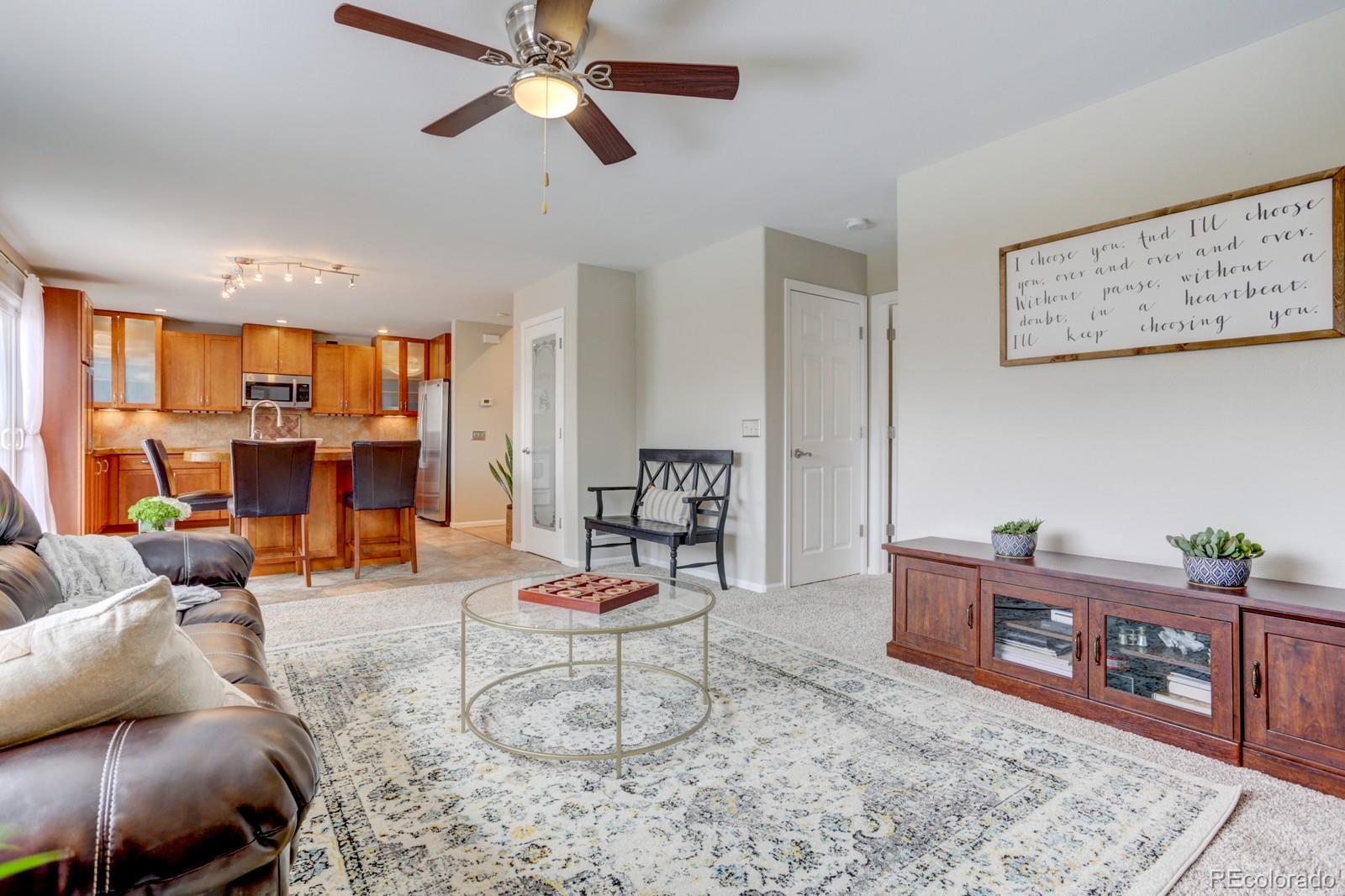 801 Riddlewood Lane Highlands Ranch, CO 80129 - Photo 12 of 40 a living room with furniture and wooden floor