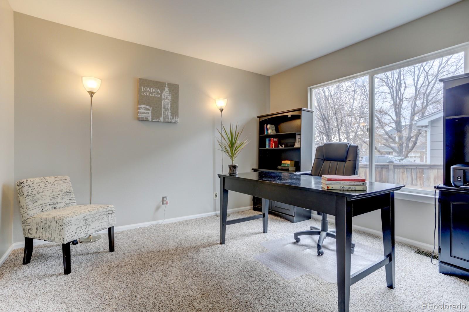 801 Riddlewood Lane Highlands Ranch, CO 80129 - Photo 13 of 40 a view of a workspace with furniture and a window