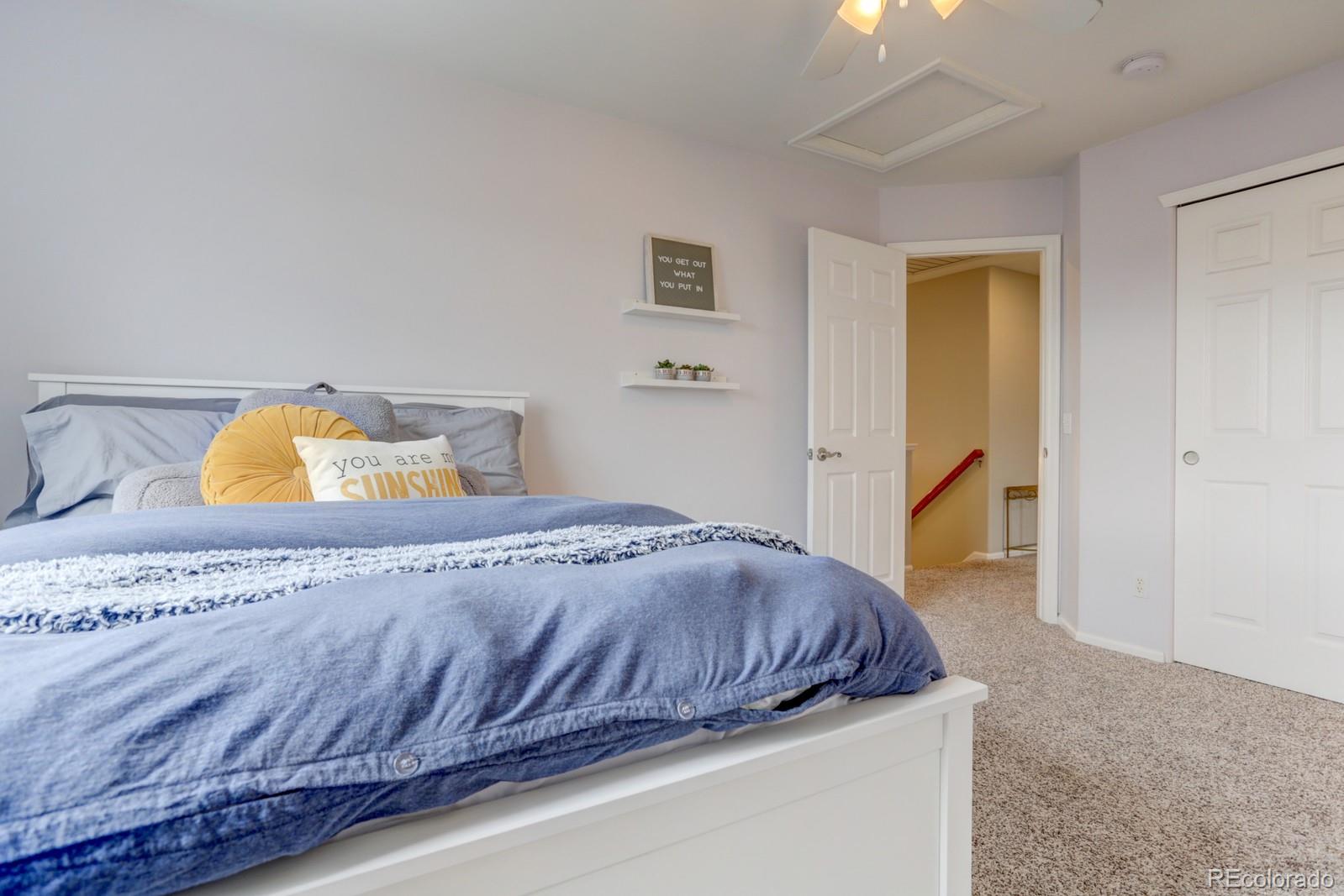 801 Riddlewood Lane Highlands Ranch, CO 80129 - Photo 23 of 40 a bedroom with a bed and dresser