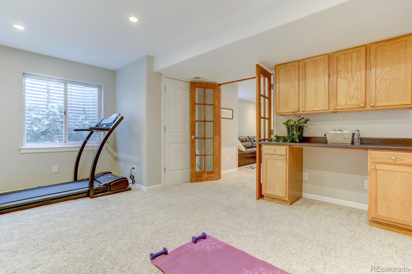 801 Riddlewood Lane Highlands Ranch, CO 80129 - Photo 32 of 40 a view of a room with gym equipment