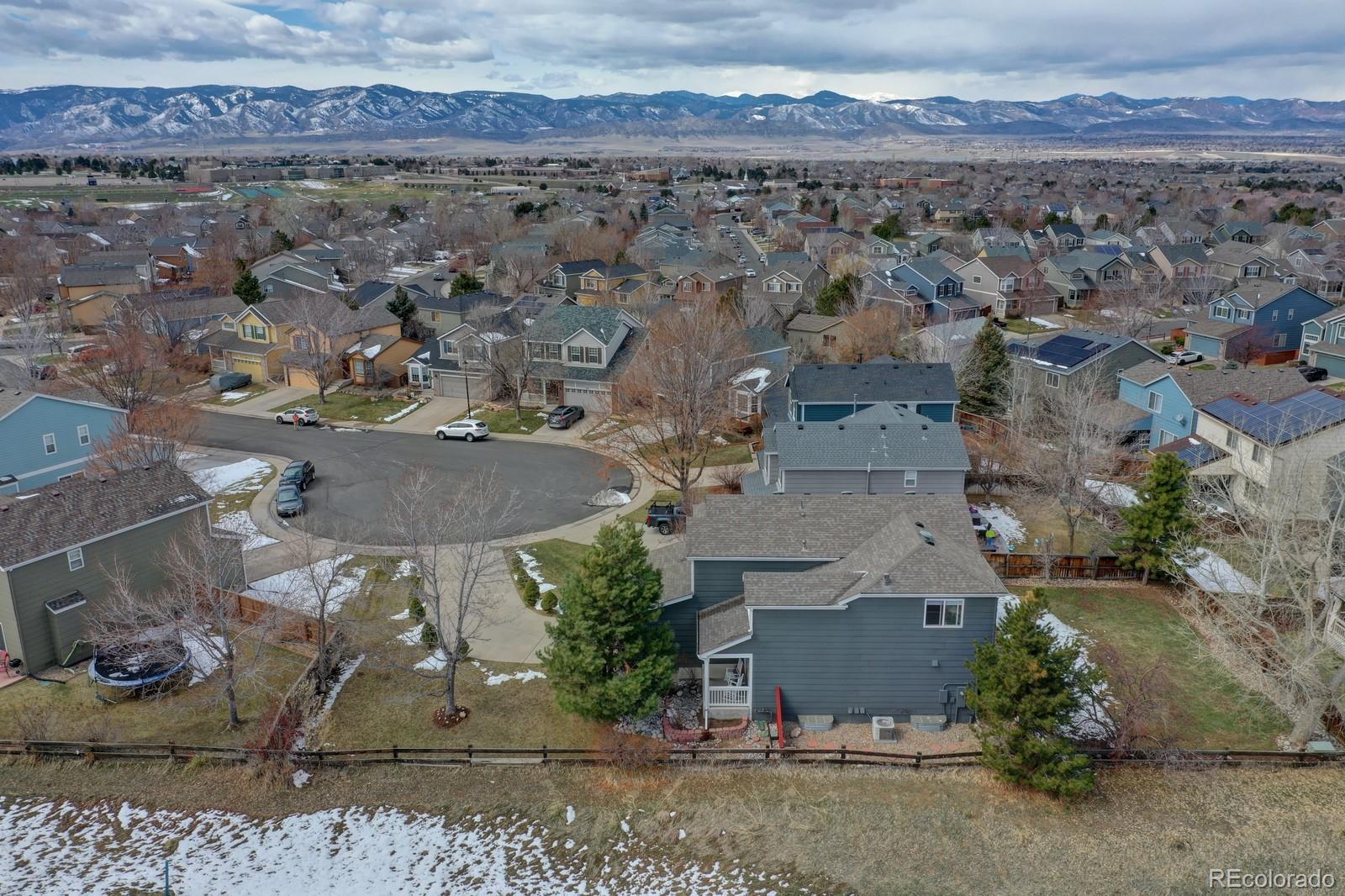 801 Riddlewood Lane Highlands Ranch, CO 80129 - Photo 37 of 40 an aerial view of a house with a yard