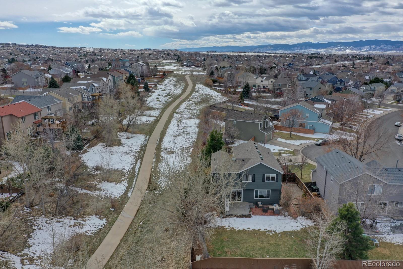 801 Riddlewood Lane Highlands Ranch, CO 80129 - Photo 39 of 40 an aerial view of a house with a yard