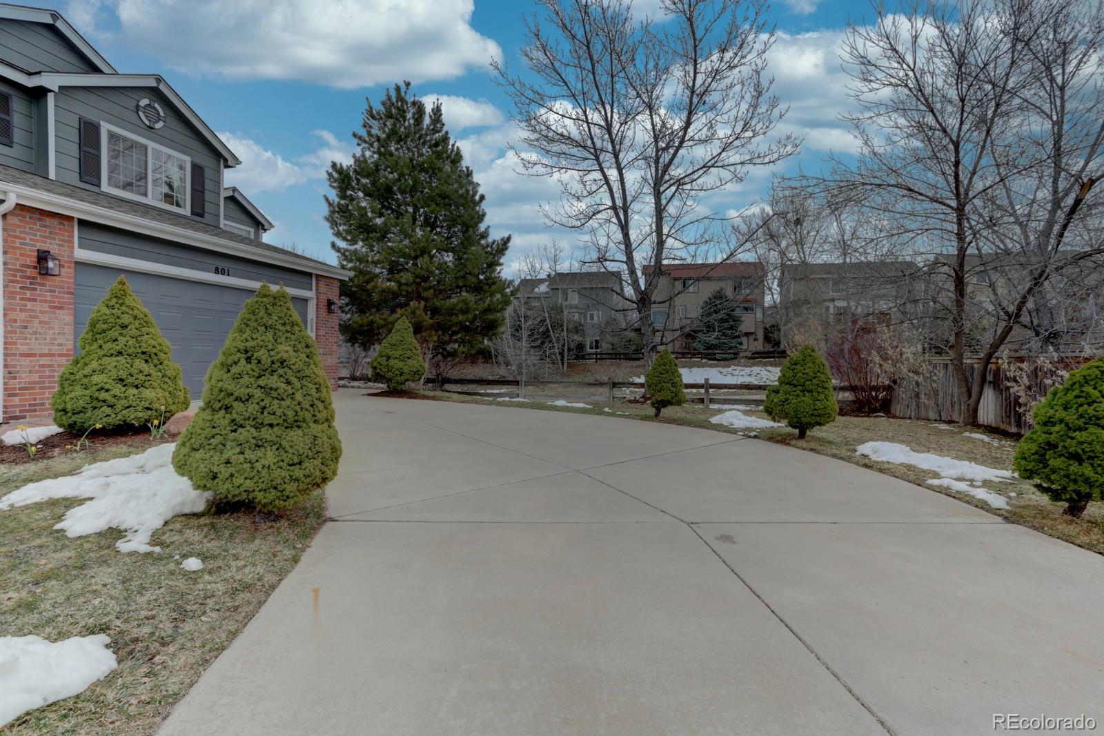 801 Riddlewood Lane Highlands Ranch, CO 80129 - Photo 40 of 40 a view of a street with potted plants and large trees