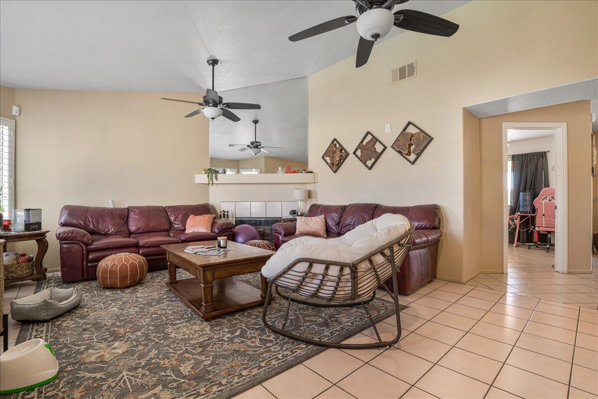 81033 Jamie Way Indio, CA 92201 - Photo 5 of 27 a living room with furniture and a chandelier