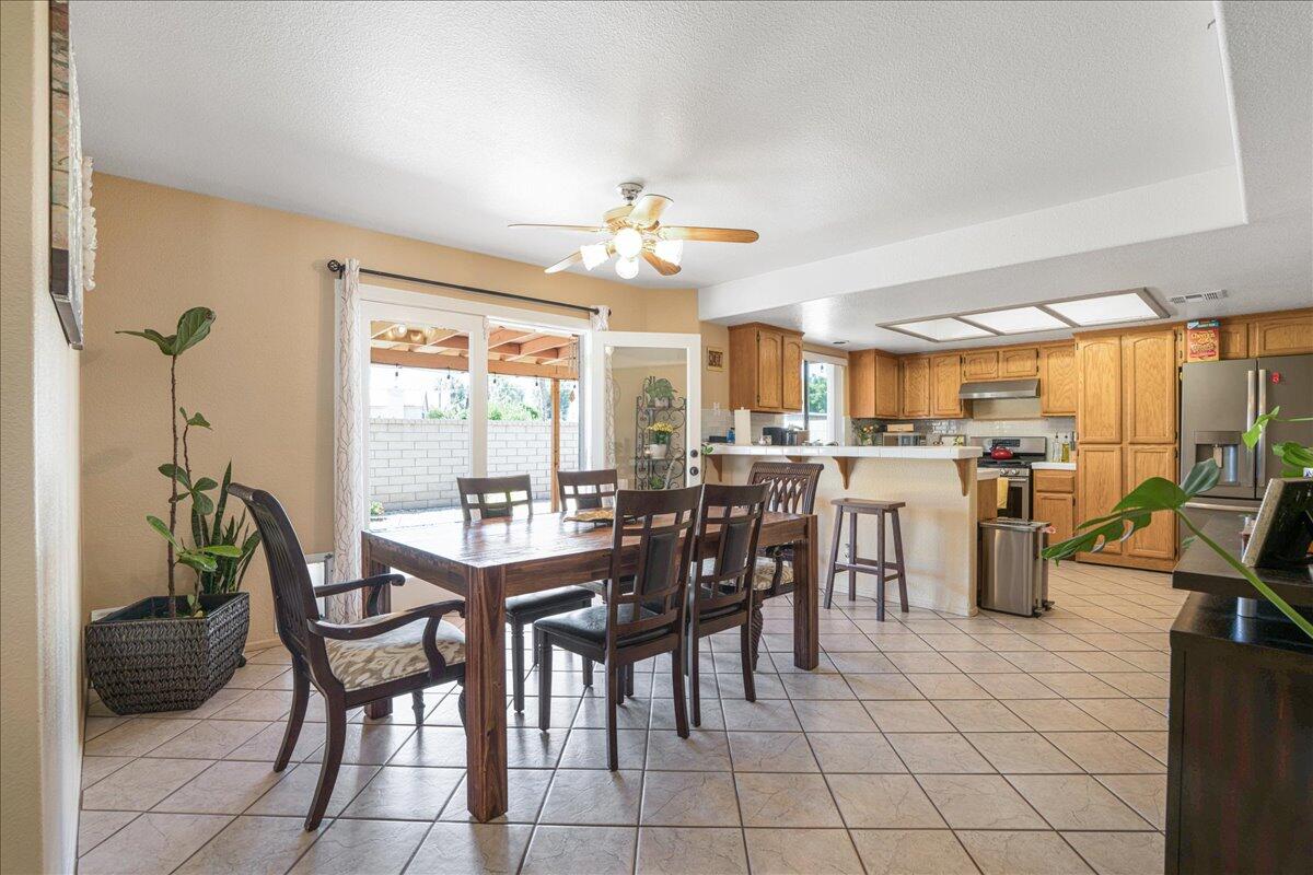 81033 Jamie Way Indio, CA 92201 - Photo 8 of 27 a view of a dining room with furniture and a chandelier