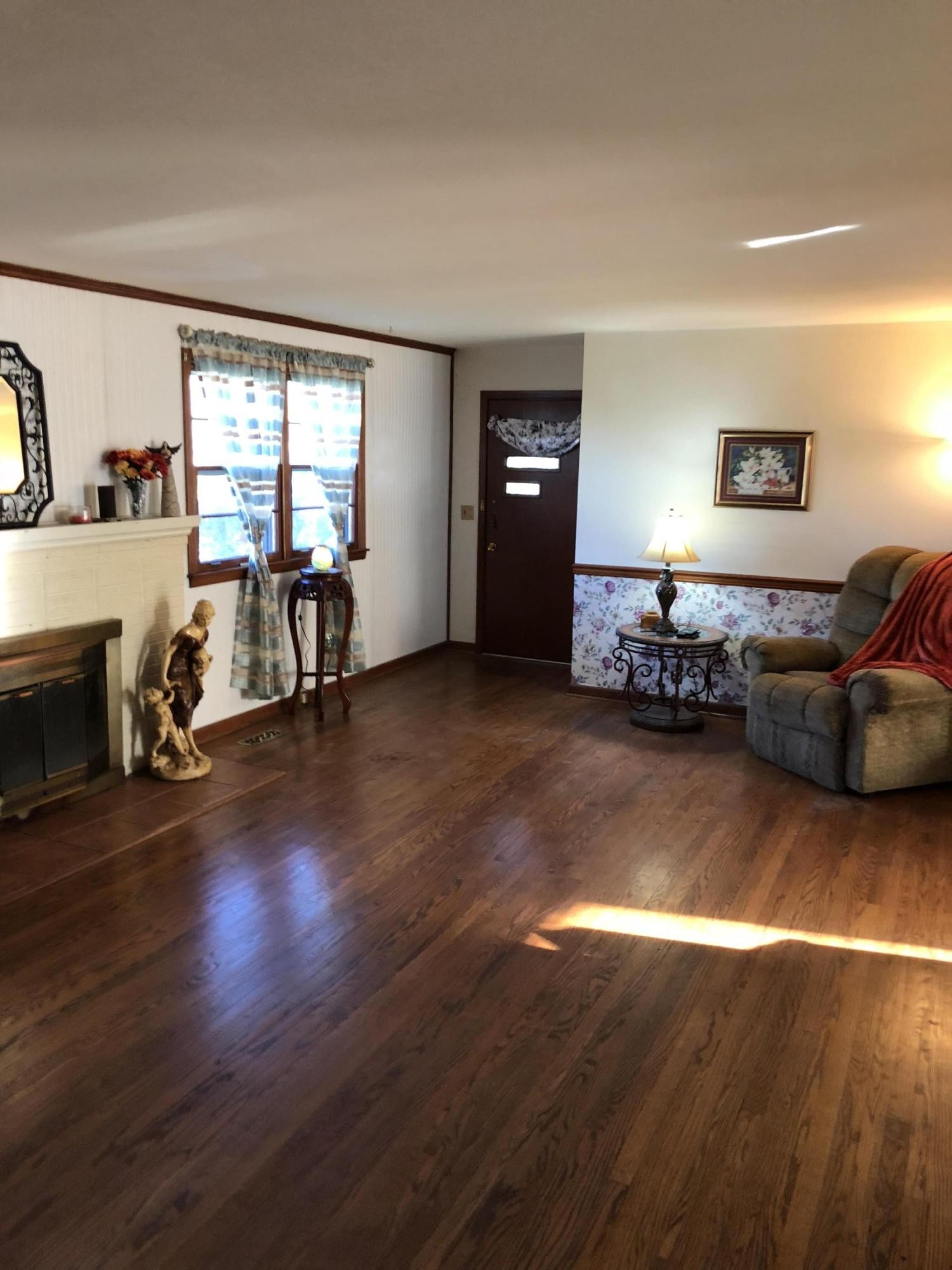 5313 Bluefield Road Knoxville, TN 37921 - Photo 14 of 18 a living room with furniture window and wooden floor