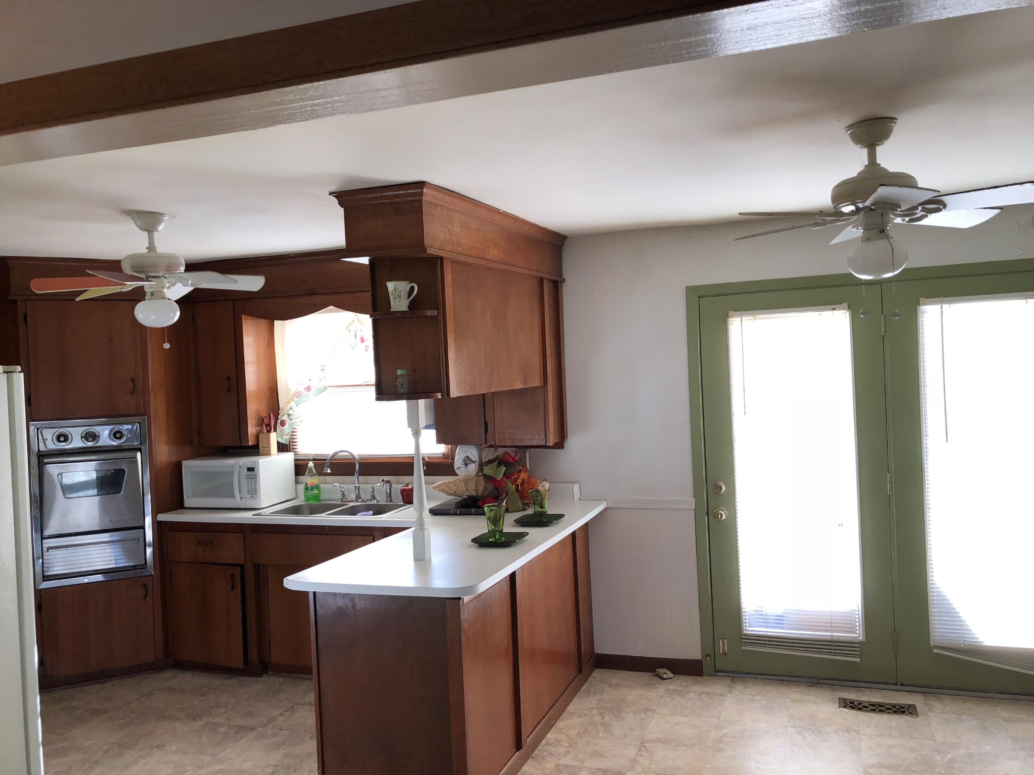 5313 Bluefield Road Knoxville, TN 37921 - Photo 6 of 18 a kitchen with a sink cabinets and window