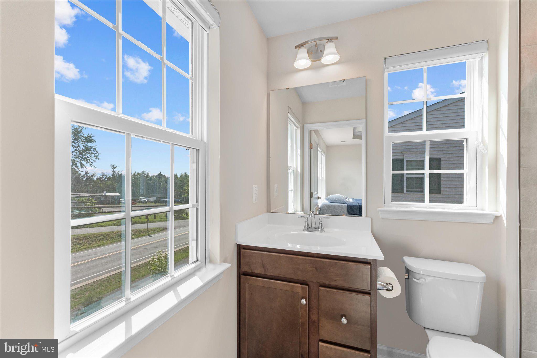 1776 Scenic Loop Culpeper, VA 22701 - Photo 22 of 36 a bathroom with a sink vanity and a toilet