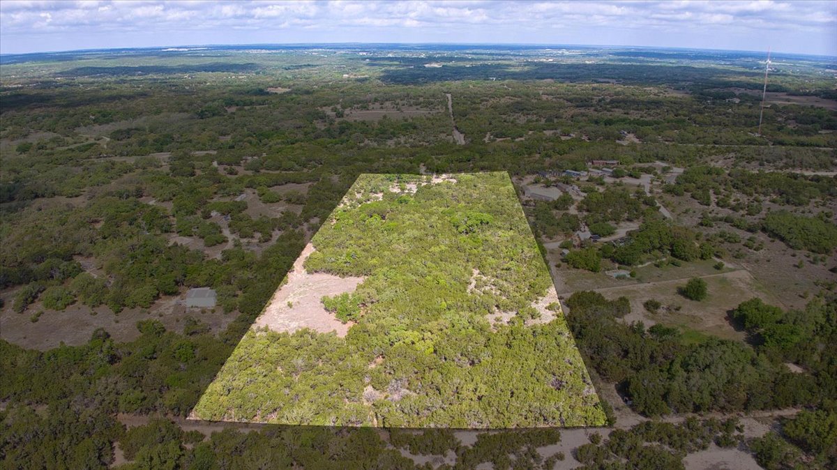 24369 Round Mountain Road, Unit 6 Leander, TX 78641 - Photo 2 of 28 Bird's eye view with a forest view