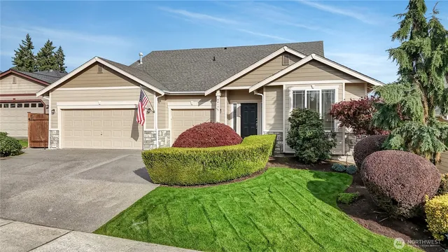 a front view of a house with garden