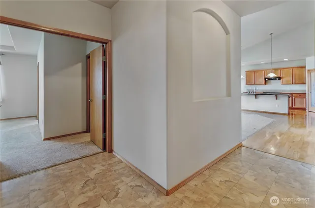 a view of a hallway with a living room