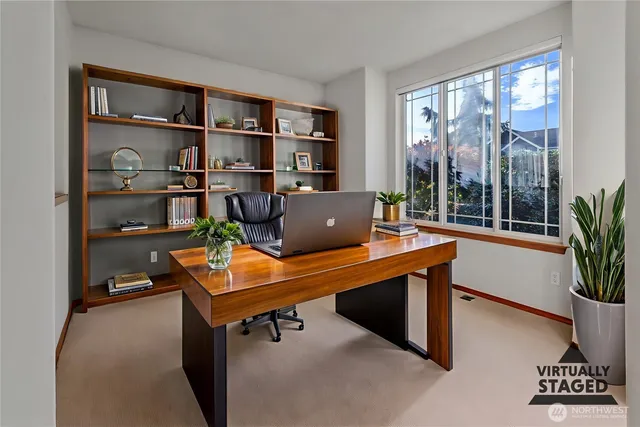 a view of workspace with a bookshelf