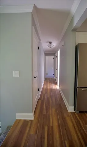 a spacious bathroom with a toilet a sink and a mirror