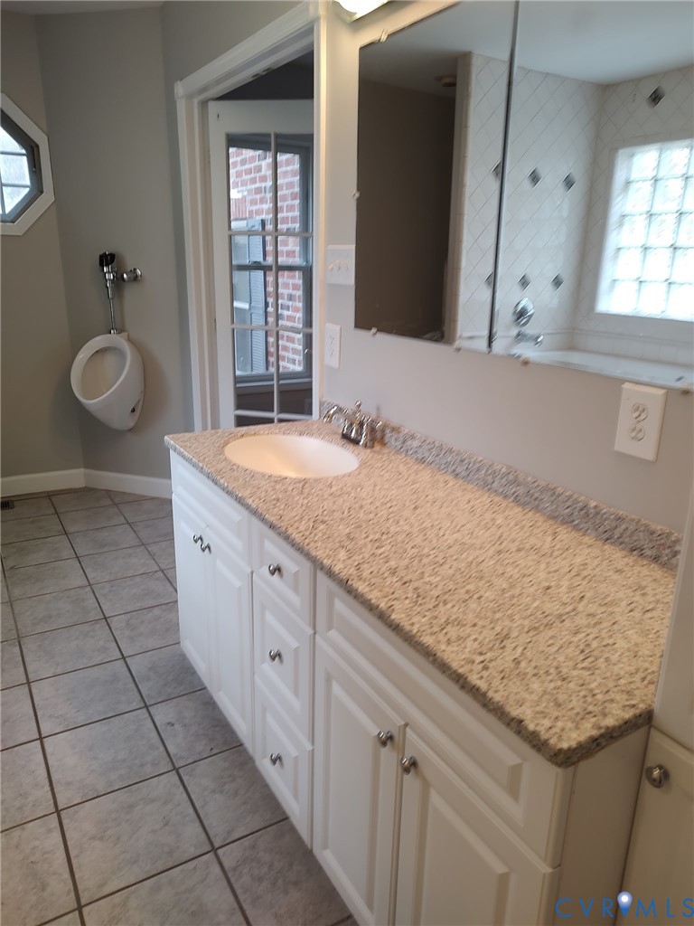 5475 Cold Harbor Road Mechanicsville, VA 23111 - Photo 15 of 29 a spacious bathroom with a granite countertop sink a toilet and mirror