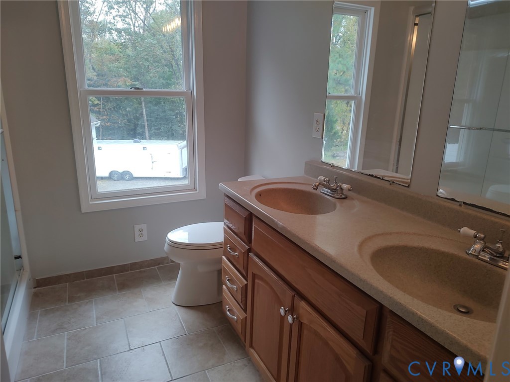5475 Cold Harbor Road Mechanicsville, VA 23111 - Photo 17 of 29 a bathroom with a sink and a toilet