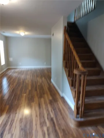 a view of entryway with wooden floor