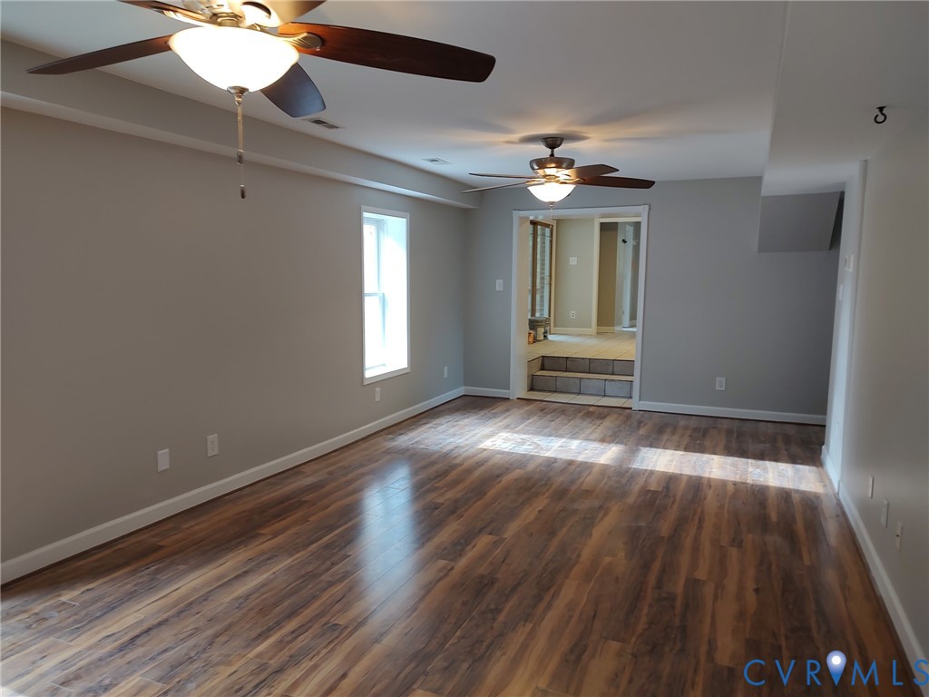 5475 Cold Harbor Road Mechanicsville, VA 23111 - Photo 6 of 29 a view of empty room with wooden floor and fan