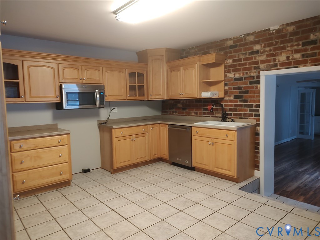 5475 Cold Harbor Road Mechanicsville, VA 23111 - Photo 7 of 29 a kitchen with a stove a sink and a refrigerator