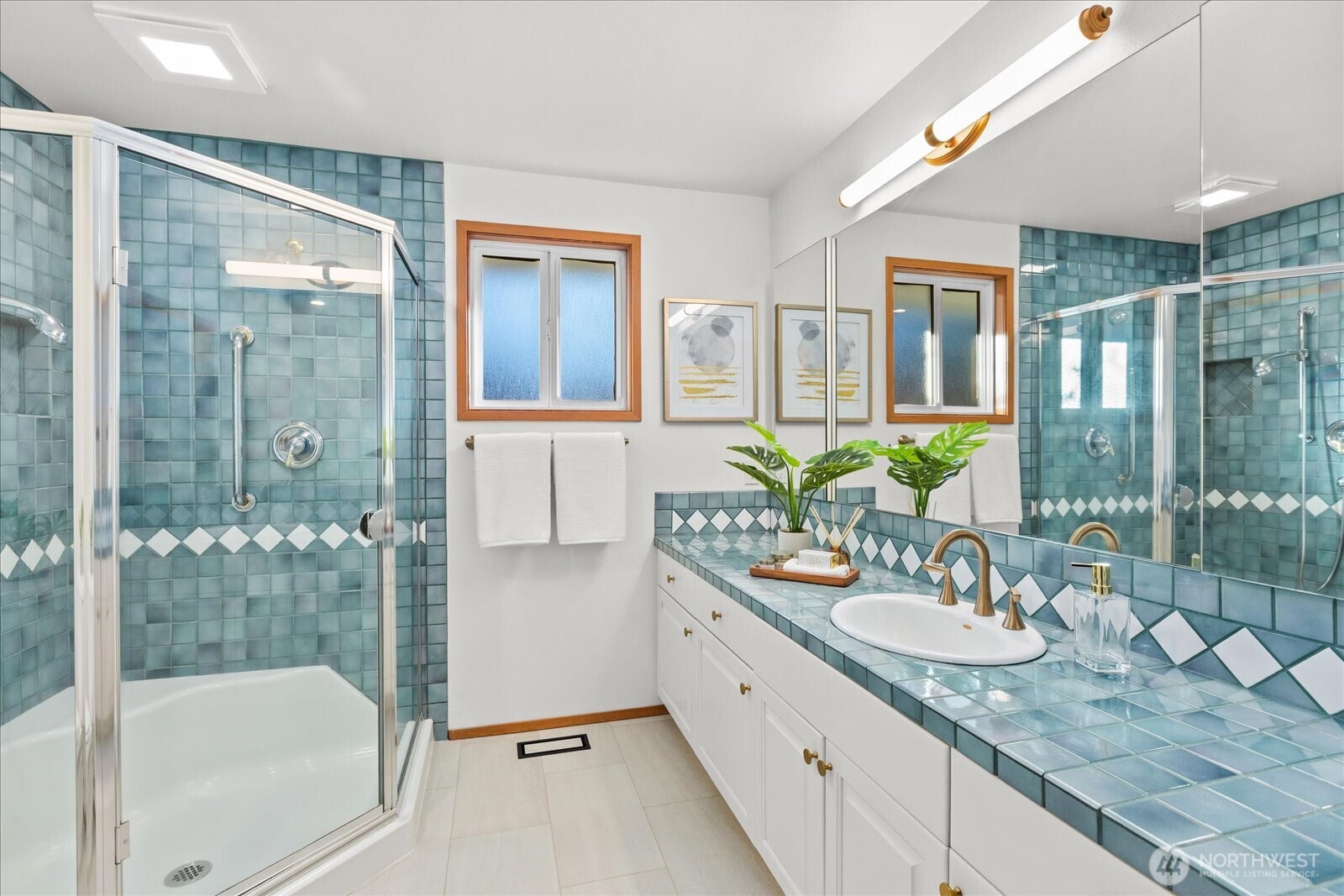 22210 96th Avenue West Edmonds, WA 98020 - Photo 15 of 35 a bathroom with a granite countertop tub sink and mirror