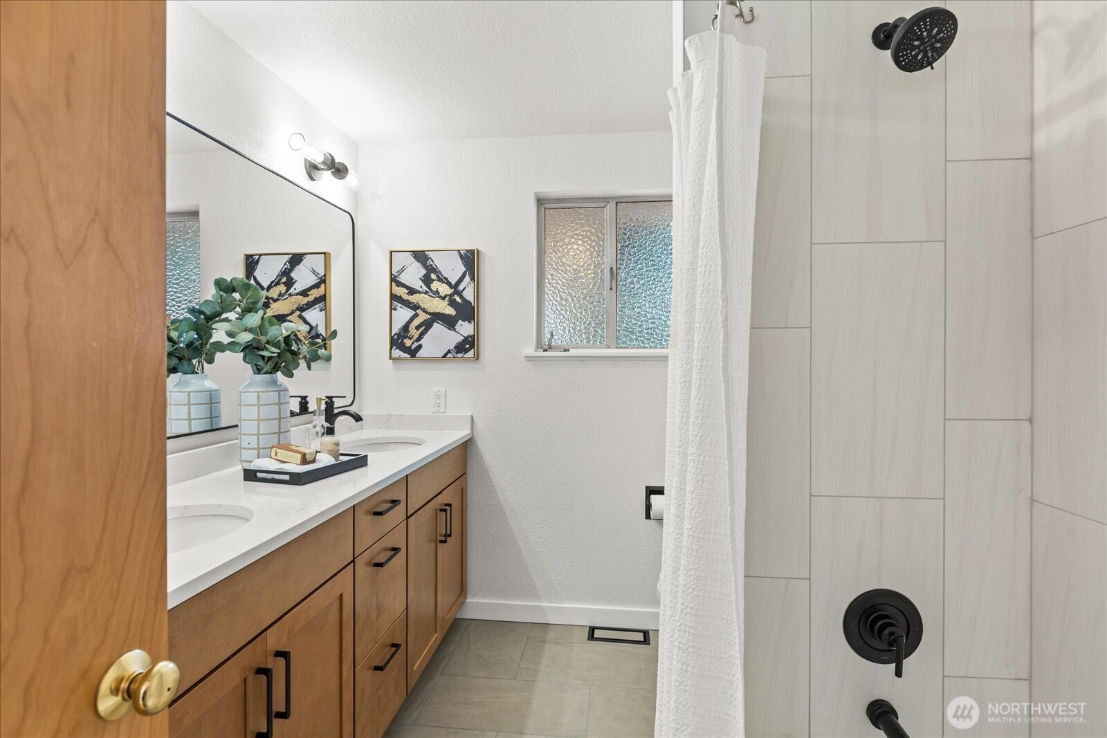 22210 96th Avenue West Edmonds, WA 98020 - Photo 19 of 35 a spacious bathroom with a double vanity sink a mirror and shower