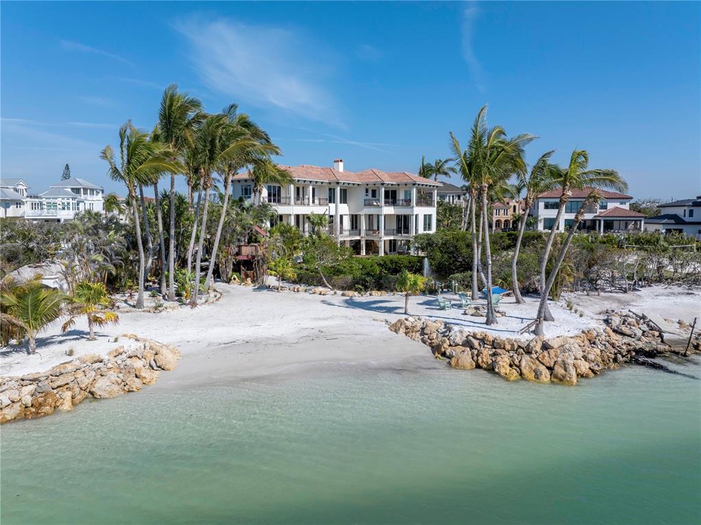3935 North Shell Road Sarasota, FL 34242 - Photo 1 of 1 a view of a house with a yard and sitting area