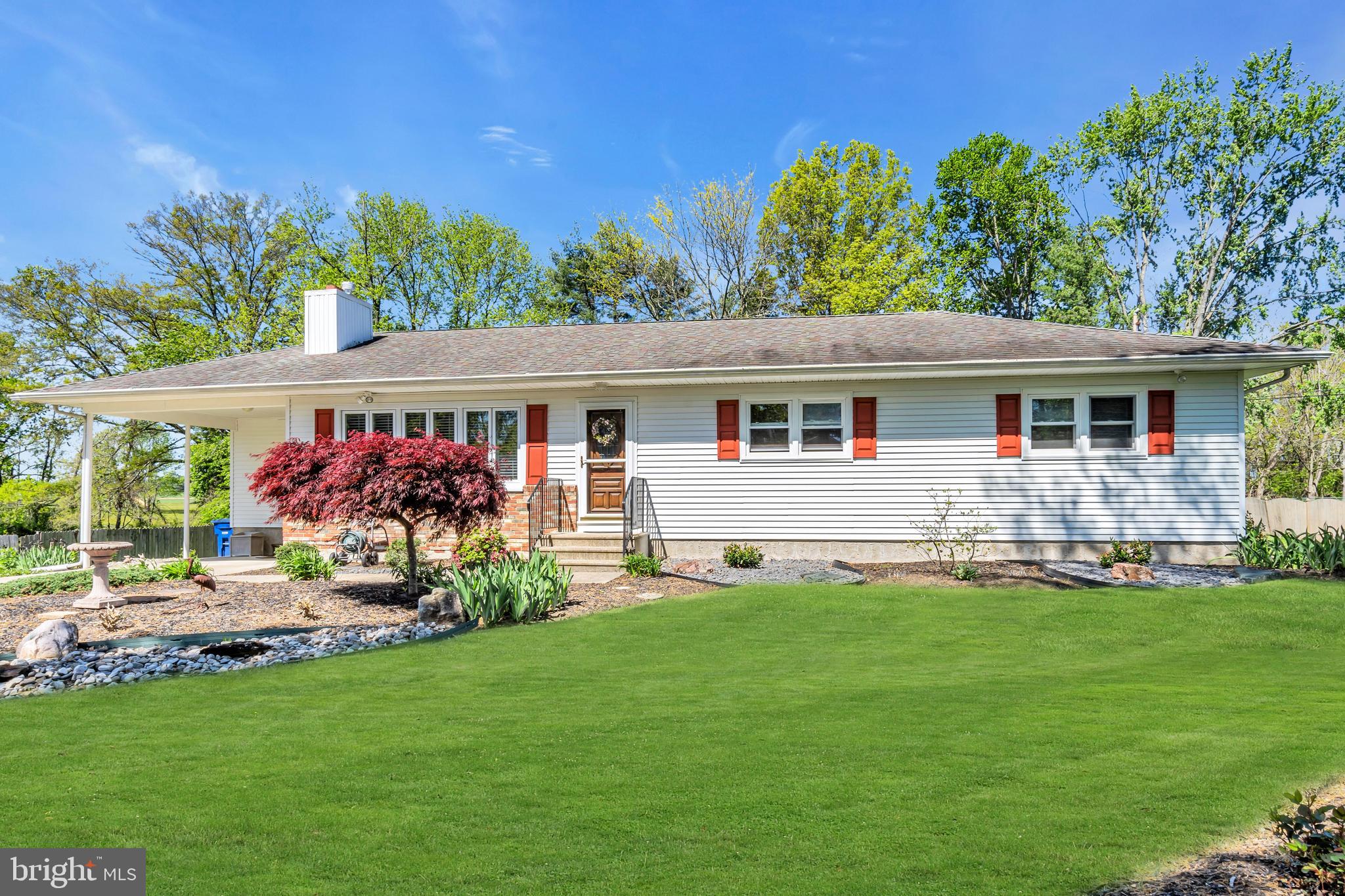 a front view of house with yard and outdoor seating