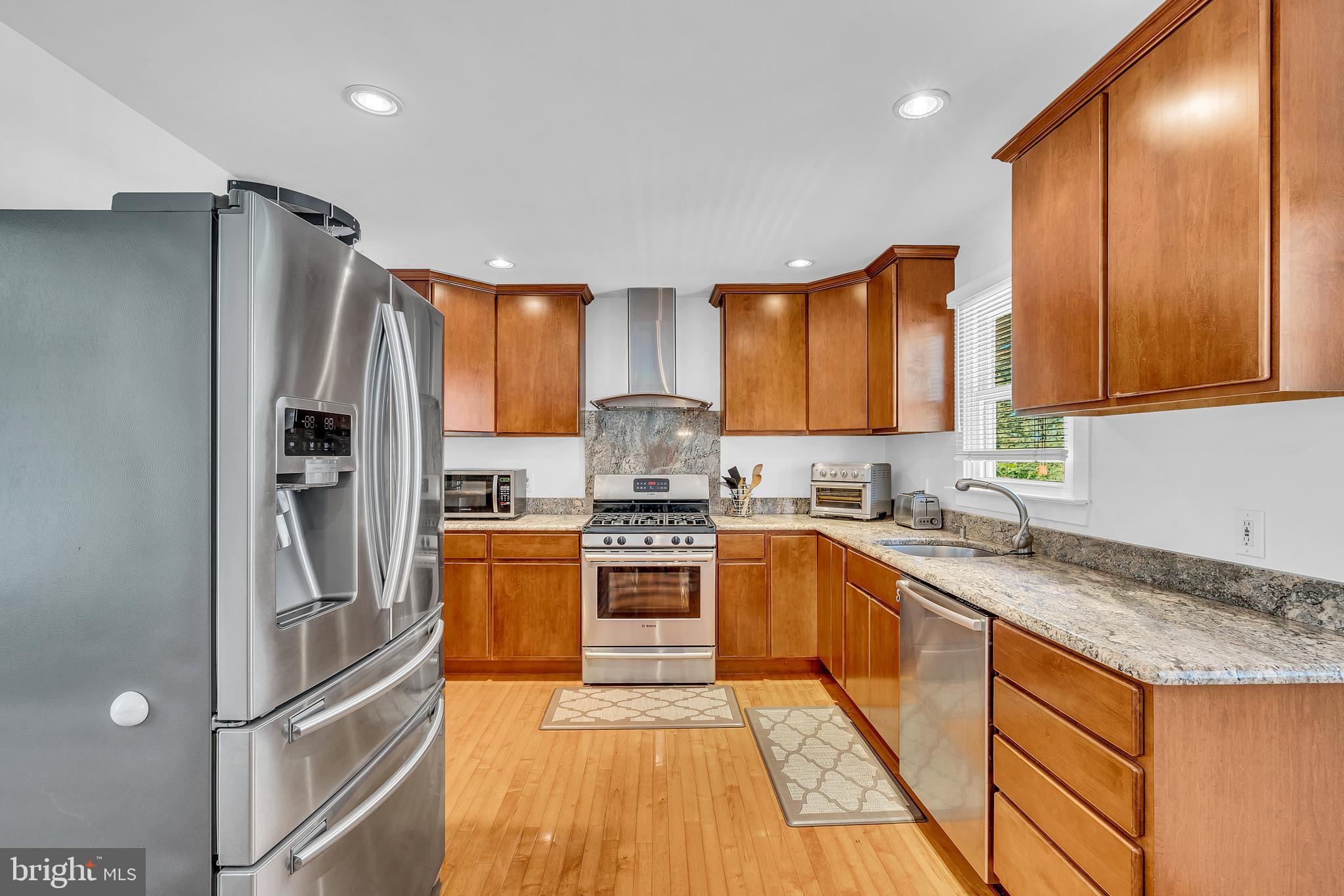 6 Park Road Mount Holly, NJ 08060 - Photo 19 of 58 a kitchen with granite countertop stainless steel appliances a sink refrigerator and cabinets