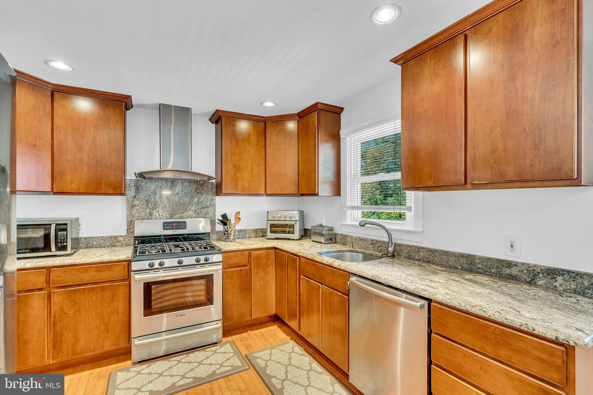 6 Park Road Mount Holly, NJ 08060 - Photo 20 of 58 a kitchen with a sink a stove cabinets and wooden floor