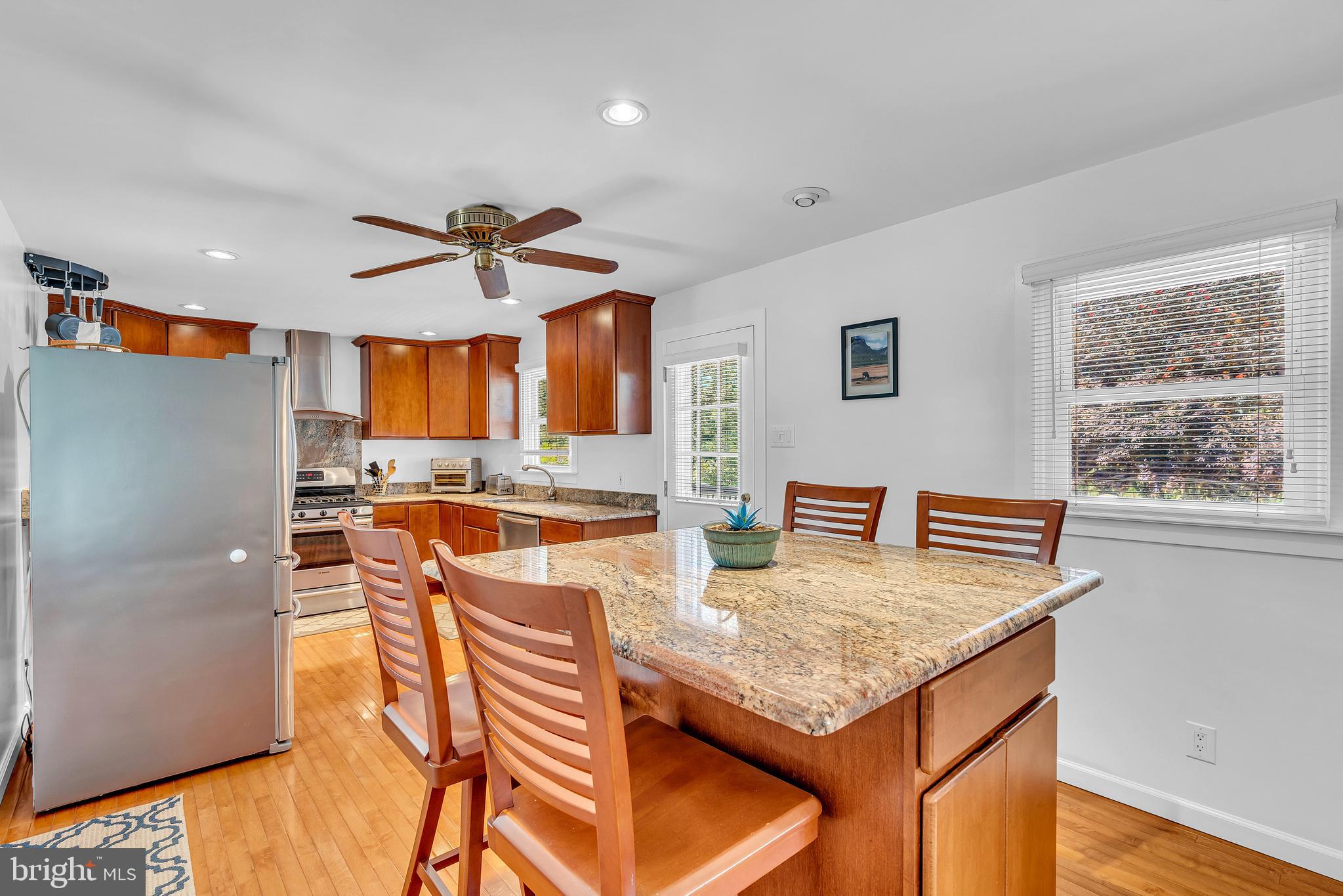 6 Park Road Mount Holly, NJ 08060 - Photo 27 of 58 a kitchen with granite countertop kitchen island stainless steel appliances a stove a sink and a refrigerator