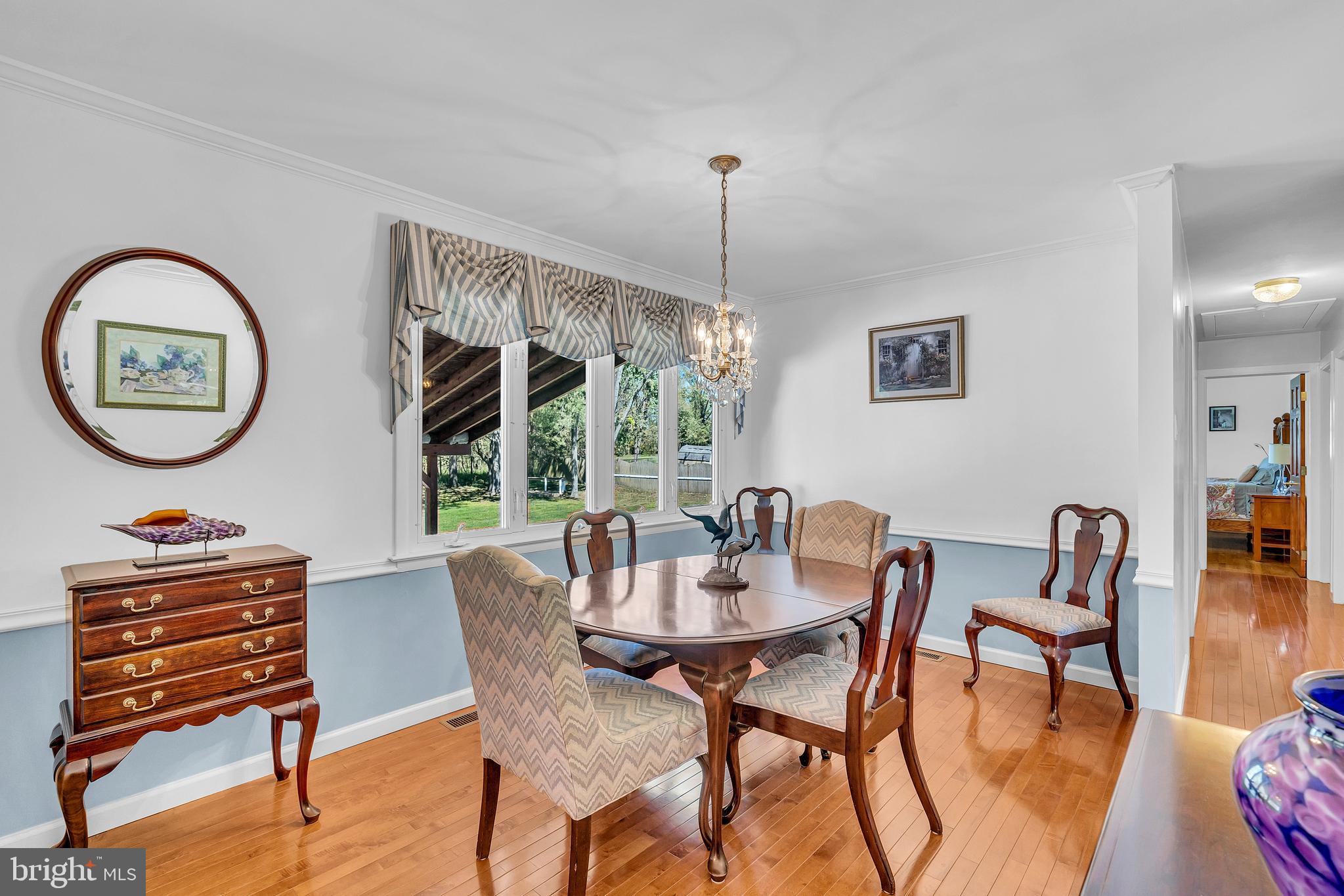 6 Park Road Mount Holly, NJ 08060 - Photo 30 of 58 a view of a dining room with furniture wooden floor and a chandelier