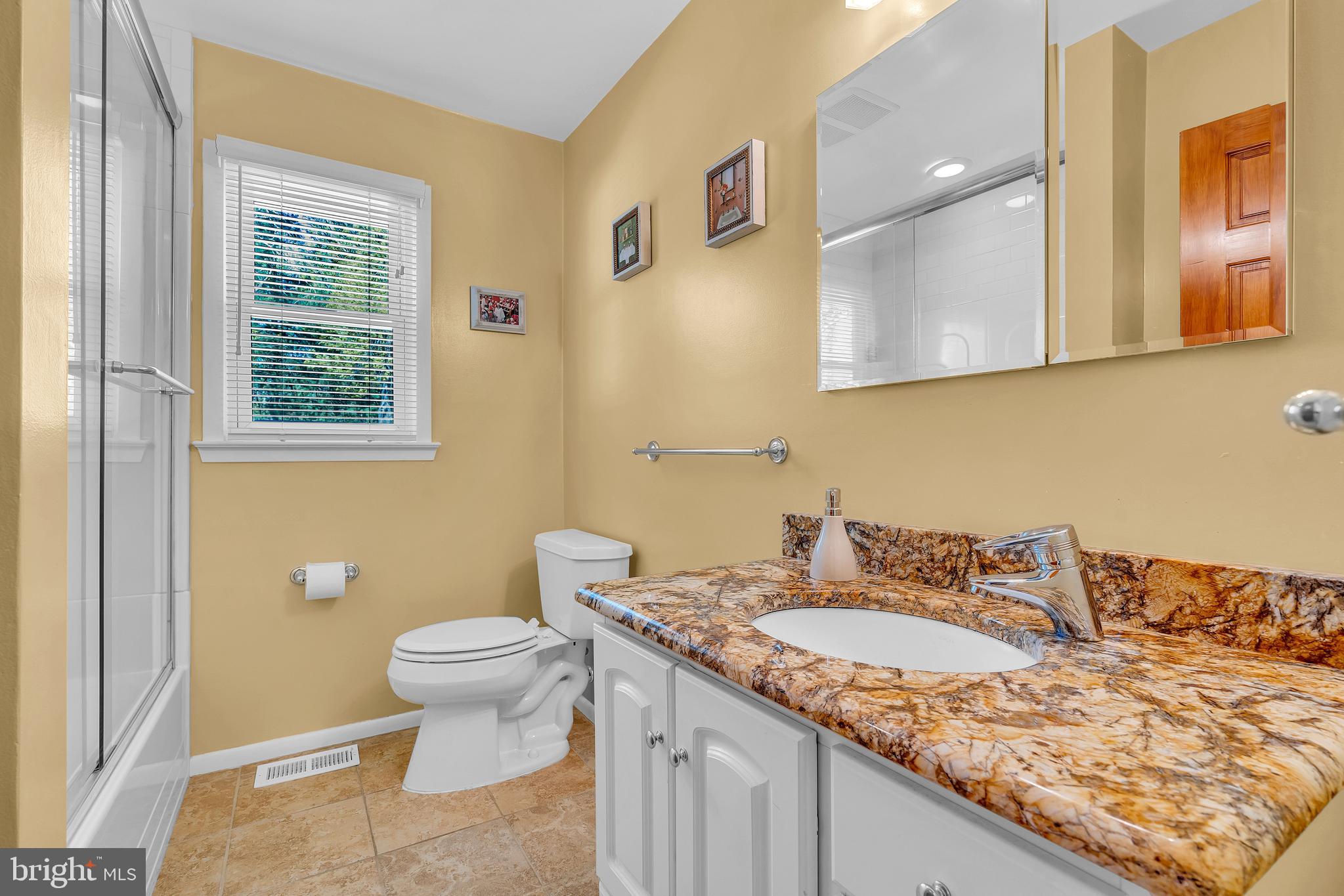 6 Park Road Mount Holly, NJ 08060 - Photo 37 of 58 a bathroom with a granite countertop sink and a toilet