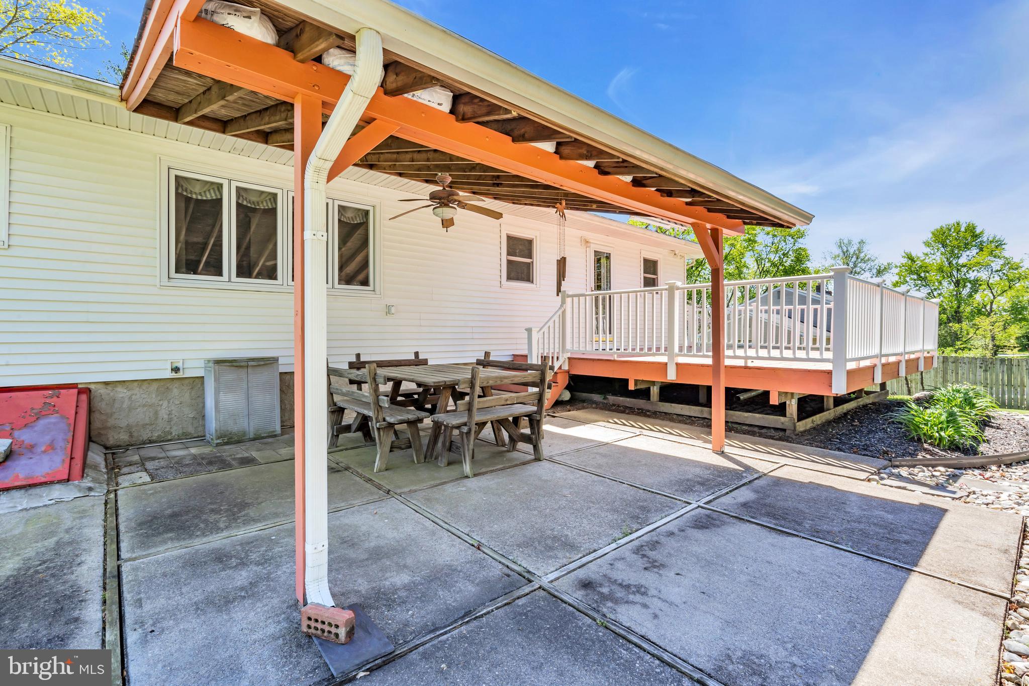 6 Park Road Mount Holly, NJ 08060 - Photo 48 of 58 a view of a patio with table and chairs with wooden fence and plants