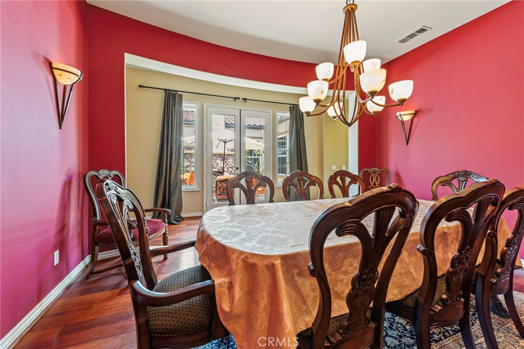 7940 Choi Drive Riverside, CA 92506 - Photo 19 of 56 a view of a dining room with furniture and chandelier
